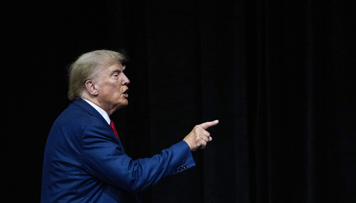 Former US president and 2024 Republican Presidential hopeful Donald Trump gestures as he leaves the stage after speaking during the South Dakota Republican Partys Monumental Leaders rally at the Ice Arena at the Monument in Rapid City, South Dakota, September 8, 2023. — AFP