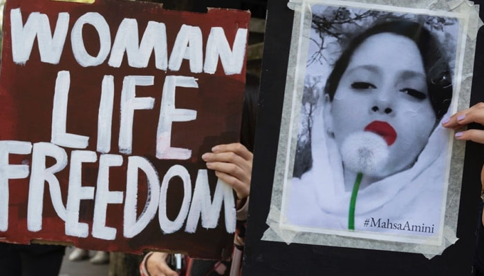 People demonstrate opposite the Embassy of Iran in Kensington to protest the death of Mahsa Amini, 22-year old Kurdish woman, who died while in police custody in Iran. — Twitter @jennymathews