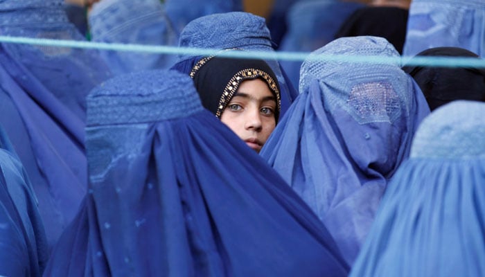 A group of Afghan women outside a local medical camp in Kabul. — AFP