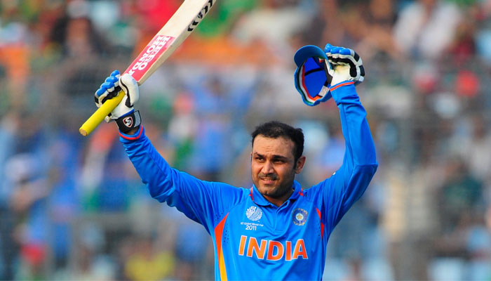 Former Indian opener Virender Sehwag gestures  bat during a cricket match in this undated image. — AFP/File