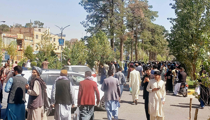 People gather on the streets in Herat on October 7, 2023. — AFP