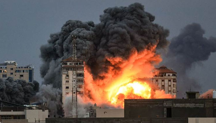 A plume of smoke rises in the sky of Gaza City during an Israeli airstrike on October 7, 2023. — AFP