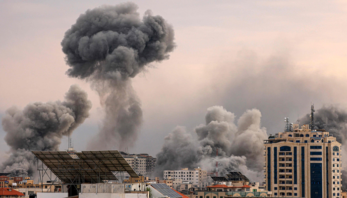 A plume of smoke rises in the sky of Gaza City during an Israeli airstrike on October 9, 2023. — AFP