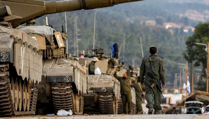 A Merkava battle tank column was amassed in the upper Galilee in northern Israel near the border with Lebanon on Oct. 11, 2023. — AFP
