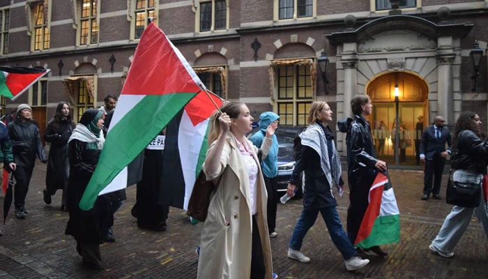 A group of students from different universities stage a demonstration in solidarity with Palestinians in The Hague, Netherlands. Al Jazeera