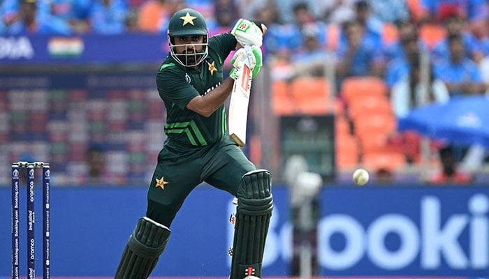 Pakistan´s captain Babar Azam watches the ball after playing a shot during the 2023 ICC Men´s Cricket World Cup one-day international (ODI) match between India and Pakistan at the Narendra Modi Stadium in Ahmedabad on October 14, 2023.