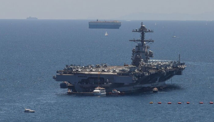 The USS Gerald R. Ford, the worlds largest warship, is seen at anchor in Faliro Bay, Athens, Greece, as part of its summer deployment, on July 28, 2023. — AFP