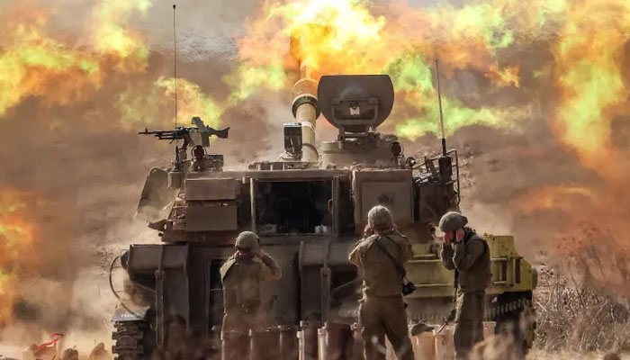 An Israeli army self-propelled howitzer fires rounds near the border with Gaza in southern Israel on Oct. 11, 2023. — AFP