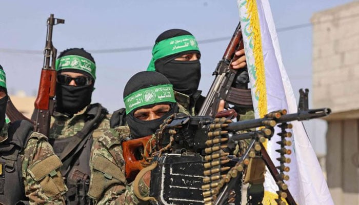 Members of the Ezz-Al Din Al-Qassam Brigades, the armed wing of the Palestinian Hamas movement, parade in Rafah in the southern Gaza Strip on May 28, 2021. — AFP