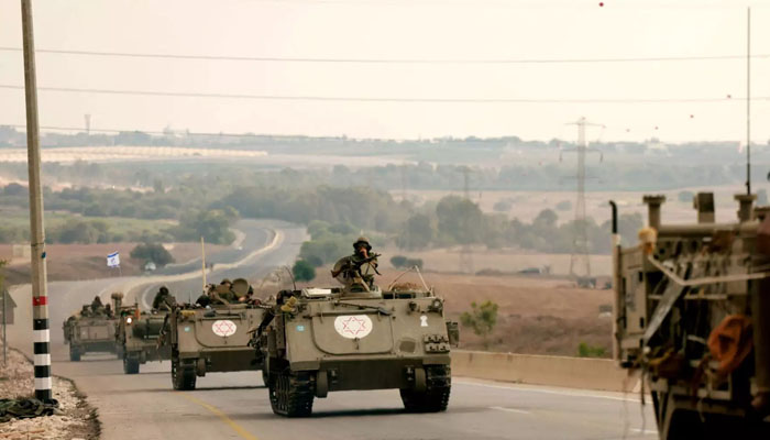 Israeli soldiers ride in their armoured vehicles towards the border with the Gaza Strip on October 16, 2023, amid the ongoing battles between Israel and the Palestinian group Hamas. — AFP