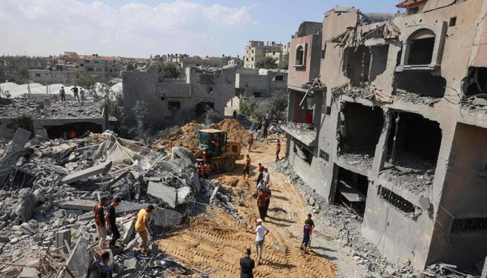 Palestinians search for victims under rubble after Israeli strikes on Rafah in southern Gaza this week. — AFP