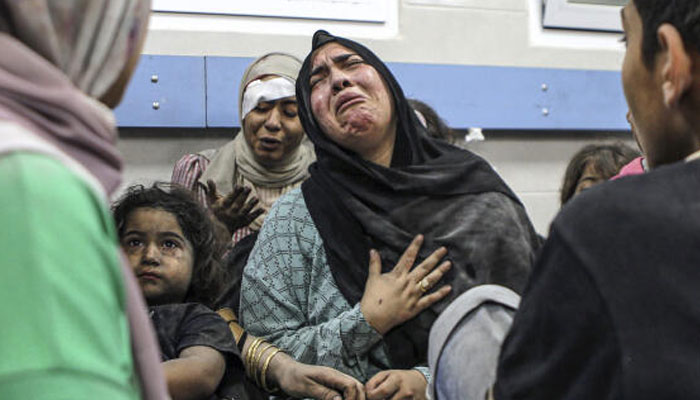 Palestinians wounded in the blast at Ahli Arab hospital, waiting to be treated at the al-Shifa hospital, in Gaza City, on October 17, 2023. — AFP