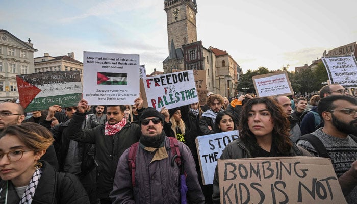 People holding flags and placards take part in rally to support Palestine as the conflict between Israel and Hamas continues at the old Town Square on October 18, 2023 in Prague. — AFP