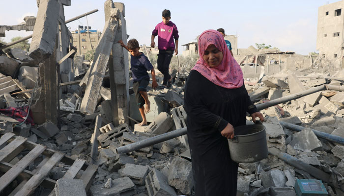 Palestinians inspect the damage after overnight Israeli strikes on Rafah in the southern Gaza Strip on October 22, 2023, amid the ongoing battles between Israel and Palestinian groups. — AFP