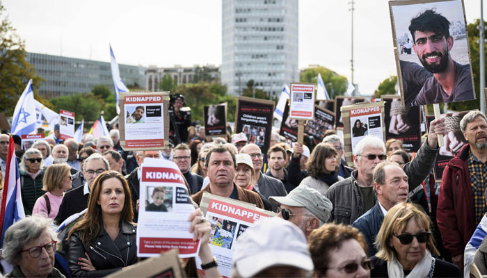 Supporters of Israel, members of the Jewish community and hostages families and friends attend a rally calling for the release of hostages held by Hamas, near the United Nations office in Geneva, on October 22, 2023. — AFP