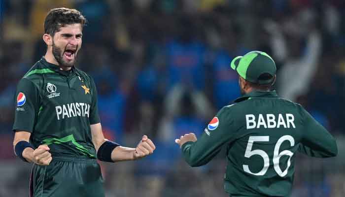 Star pacer Shaheen Shah Afridi celebrates with captain Babar Azam (R) after taking the wicket of Afghanistans Rahmanullah Gurbaz during the 2023 ICC Men´s Cricket World Cup one-day international (ODI) match between Pakistan and Afghanistan at the MA Chidambaram Stadium in Chennai on October 23, 2023. —AFP