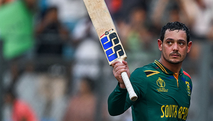 South Africas Quinton de Kock gestures as he walks back to the pavilion after his dismissal during the 2023 ICC Mens Cricket World Cup one-day international (ODI) match between South Africa and Bangladesh at the Wankhede Stadium in Mumbai on October 24, 2023. — AFP