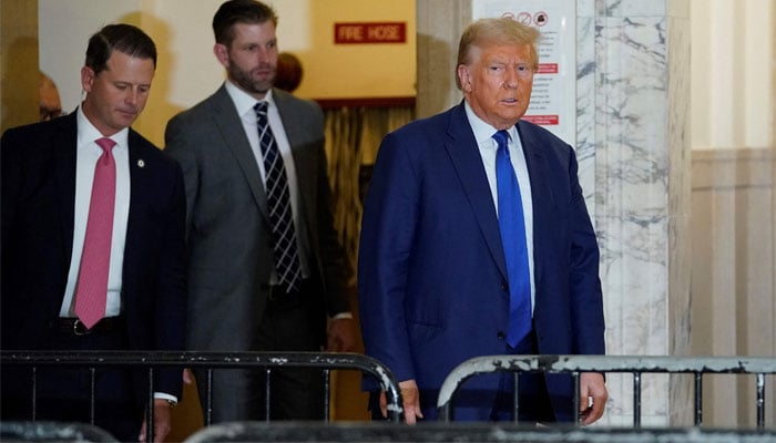 Former US President Donald Trump speaks to the press during a break in Trump´s fraud trial in New York on October 25, 2023. — AFP