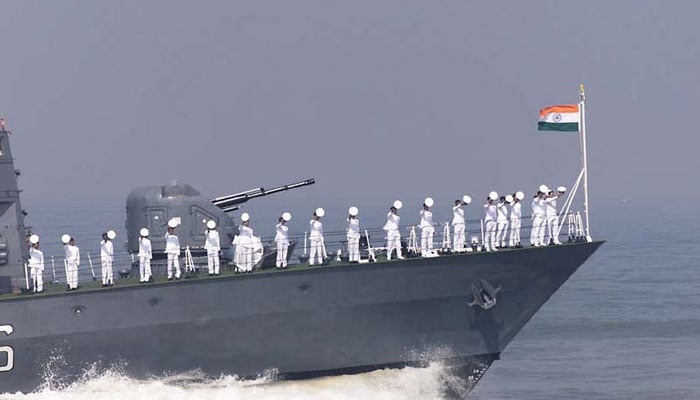 Indian Navy personnel salute from a naval ship. — AFP/File