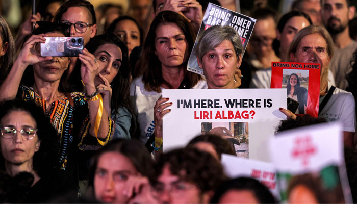 Protesters gather with posters identifying Israeli hostages held by Palestinian militants since the October 7 attack during a demonstration calling for their release in Tel Aviv on October 26, 2023. — AFP