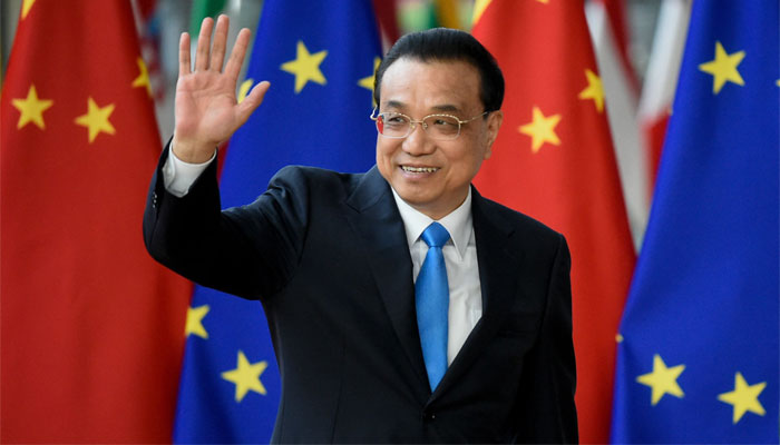 Chinese Premier Li Keqiang waves before the EU-China Summit at the EU headquarters in Brussels on April 9, 2019. — AFP