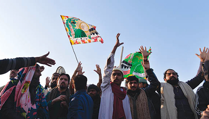 Workers of the Tehreek-e-Labaik Pakistan (TLP) chants slogans during the Faizabad sit-in. — AFP/File