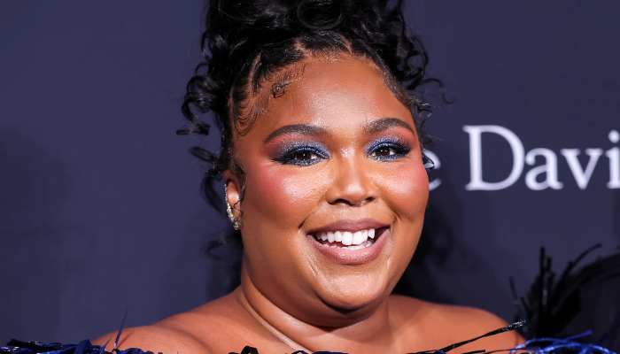 Lizzo gets support from 18 tour staffers against harassment lawsuit