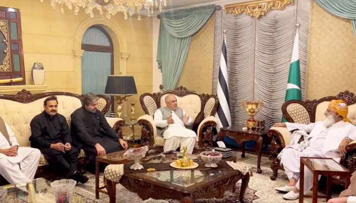 PTIs senior leadership meets JUI-F chief Maulana Fazlur Rehman (right) in Islamabad, on October 26, 2023, in this still taken from a video. — X/ @juipakofficial