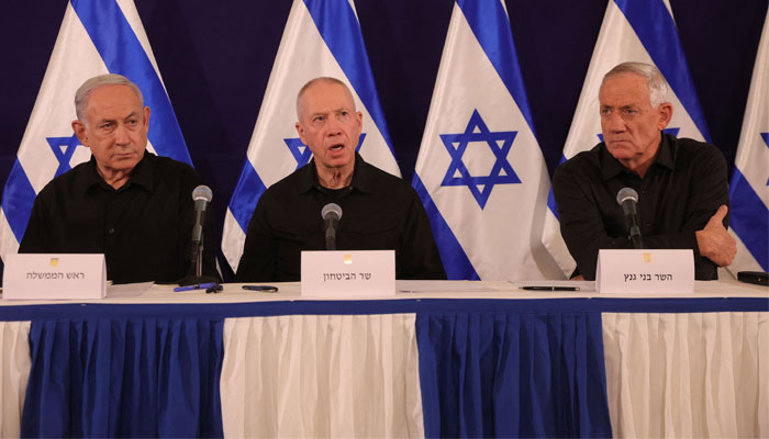 Israeli Prime Minister Benjamin Netanyahu (L), Defence Minister Yoav Gallant (C) and Cabinet Minister Benny Gantz hold a press conference in the Kirya military base in Tel Aviv on October 28, 2023, amid ongoing battles between Israel and Palestine. — AFP