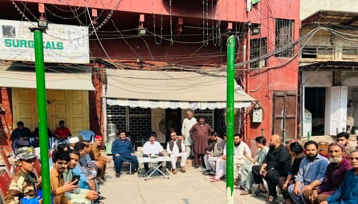 AML chief Sheikh Rashid Ahmed interacts with his party supporters outside the Lal Haveli after his victory in the court on October 30, 2023. — X/@ShkhRasheed