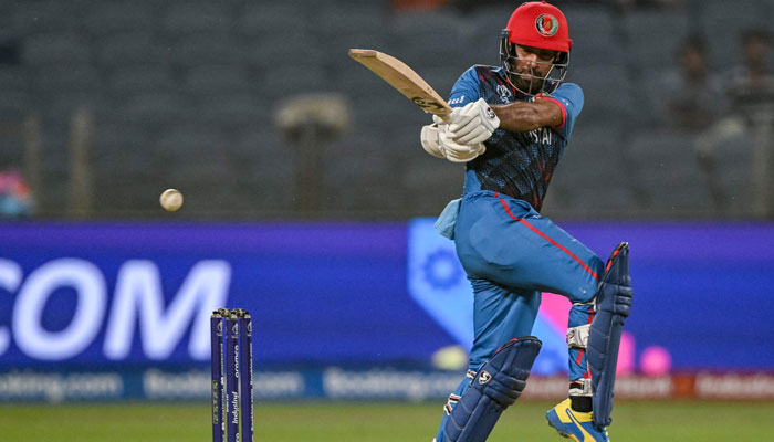 Afghanistan’s captain Hashmatullah Shahidi plays a shot during the 2023 ICC Men’s Cricket World Cup one-day international (ODI) match between Afghanistan and Sri Lanka at the Maharashtra Cricket Association Stadium in Pune on October 30, 2023. — AFP