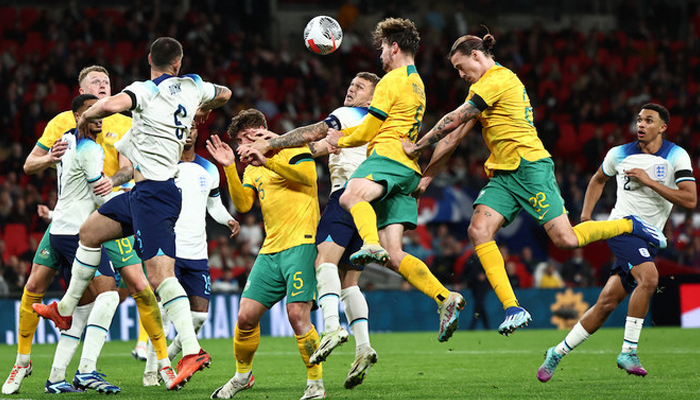 England’s Kieran Trippier, center, vies with Australia’s Jackson Irvine, second right, Connor Metcalfe, third right, and Jordan Bos, center left, during their international friendly at Wembley stadium on October 13, 2023. — AFP