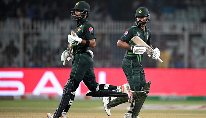 Pakistans Fakhar Zaman (right) and Abdullah Shafique run between the wickets during a World Cup match between Pakistan and Bangladesh at the Eden Gardens in Kolkata on October 31, 2023. — AFP