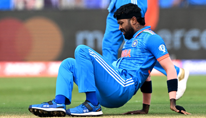 Indias Hardik Pandya falls on the field during the 2023 ICC Men´s Cricket World Cup one-day international (ODI) match between India and Bangladesh at the Maharashtra Cricket Association Stadium in Pune on October 19, 2023. — AFP