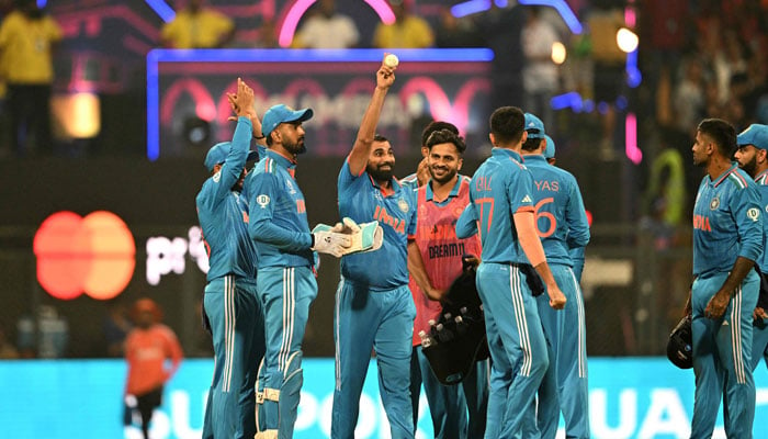 India’s Mohammed Shami (3L) celebrates with teammates after taking the wicket of Sri Lanka´s Kasun Rajitha during the 2023 ICC Men´s Cricket World Cup one-day international (ODI) match between India and Sri Lanka at the Wankhede Stadium in Mumbai on November 2, 2023. — AFP