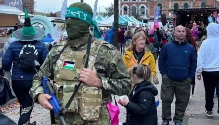 A person wearing a Hamas costume at a Halloween party in Ireland. — Ireland police