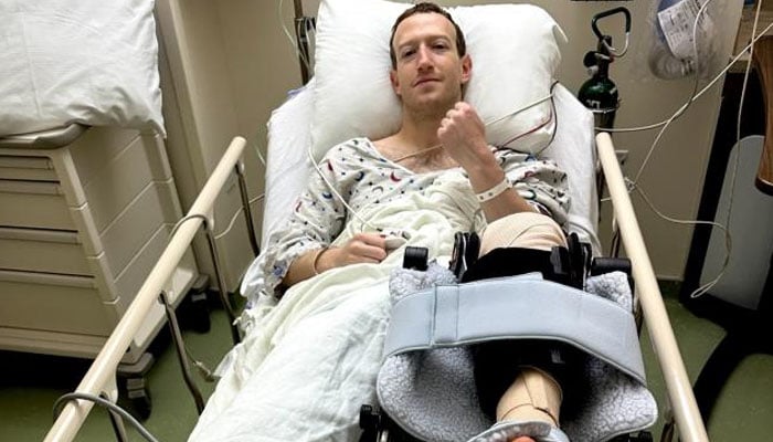 Mark Zuckerberg lies in a hospital bed with a cast on his left leg after tearing his anterior cruciate ligament. — Instagram/@zuck