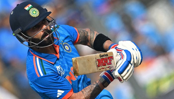 India´s Virat Kohli plays a shot during the 2023 ICC Men´s Cricket World Cup one-day international (ODI) match between India and Sri Lanka at the Wankhede Stadium in Mumbai on November 2, 2023. — AFP