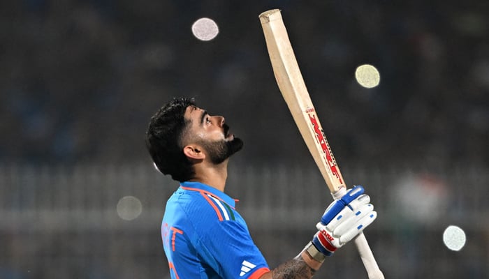 India´s Virat Kohli celebrates after scoring a century (100 runs) during the 2023 ICC Men´s Cricket World Cup one-day international (ODI) match between India and South Africa at the Eden Gardens in Kolkata on November 5, 2023. — AFP