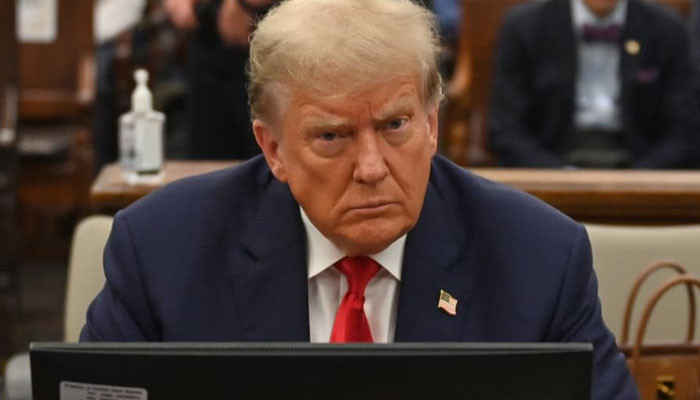 Former President Donald Trump sits in the courtroom for the third day of his civil fraud trial in New York, Oct 4, 2023. — AFP