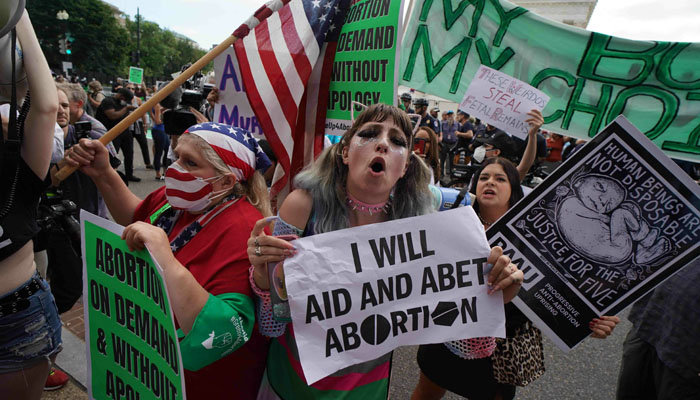 Pro-choice and anti-abortion demonstrators gather outside the US Supreme Court in Washington, DC, on June 24. — AFP