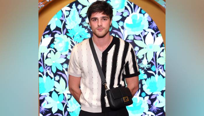 Jacob Elordi spills the tea about his purse as he carries it outside his home