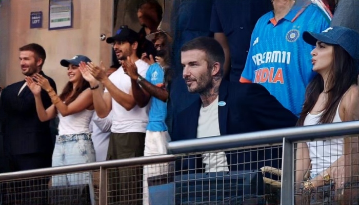 David  Beckham graciously posed for pictures with two female fans at the stadium.