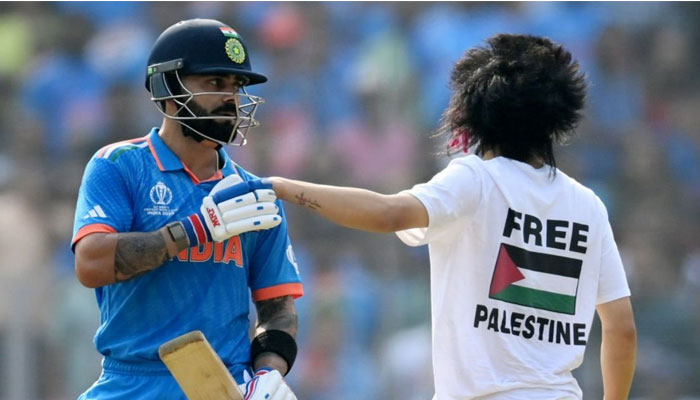 A pitch invader interrupts the ICC Cricket World Cup final match between India and Australia at Ahmedabads Narendra Modi stadium on November 19, 2023. — X/@iihtishamm