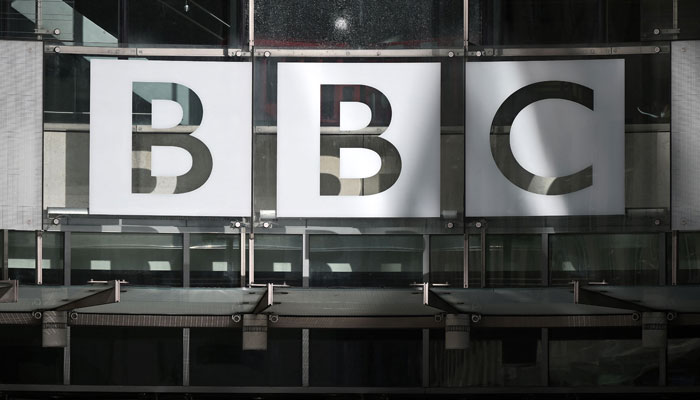 A photograph taken on October 6, 2022, shows the BBC logo at the entrance of the BBC headquarters at Broadcasting House in central London. — AFP