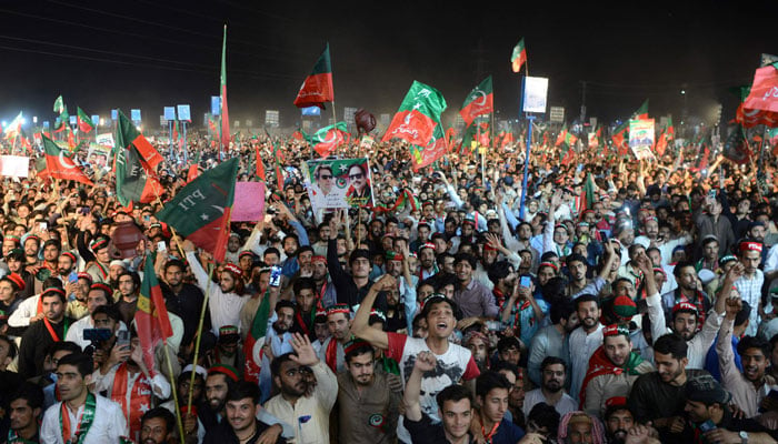 PTI workers at a public gathering in this undated picture. — AFP/File