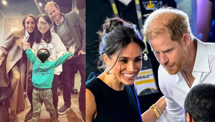 Prince Harry and Meghan Markle pose with a royal fan during their trip to Vancouver