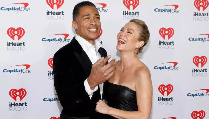 Amy Robach, T.J. Holmes proudly pack PDA at Jingle Bell red carpet