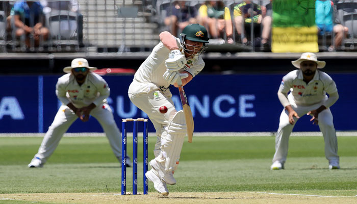 Australias David Warner plays a shot during the first day of the first Test cricket match between Australia and Pakistan at Optus Stadium in Perth on December 14, 2023. — AFP