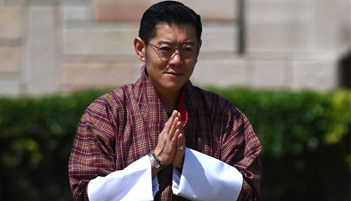 Bhutan´s King Jigme Khesar Namgyel Wangchuck pays respect at the Mahatma Gandhi memorial at Rajghat in New Delhi on April 4, 2023. — AFP